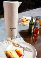 A SHIT EATING GRIN LARGE SERVING PITCHER